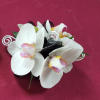  Beautiful prom corsage.  Please call to discuss the colors of