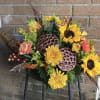 Cornucopia with a variety of fall flowers.