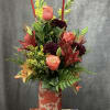 Fall vase arrangement with warm colors.