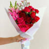 Bold and passionate, this romantic wrapped bouquet features garden roses, snapdragons, and