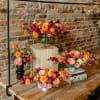 Celebrate October holidays with vibrant gold marigolds, contrasted with rich wine roses