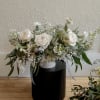 Lovely soft whites and eucalyptus. A classy, simple and elegant table arrangement.
