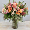 This arrangement features an array of our favorite florals; dahlias, roses, and