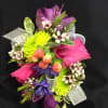 Colorful bouquet with pink roses, purple blooms, and lime-green flowers