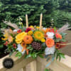 A modern autumn low centerpiece, with softer and brighter autumn colors of