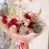 A medium-sized bouquet made with seasonal flowers that are available in our
