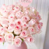 This bouquet of soft pink roses in a pink vase is the