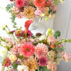 Featuring rich orange, coral, and peach colors that aim to capture the