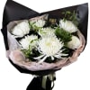 Pure white chrysanthemums with lush greenery, wrapped in soft blush tissue and