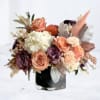 The Autumn Whisper is a refined floral arrangement that captures the warmth