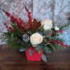 Not your everyday centerpiece, this artisanal mix of roses and berries is