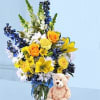 Boy color flowers arranged in a vase and Teddy Bear.