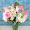 Pink roses with white hydrangea in a cylinder T leaf vase and