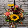 Celebrate the beauty of the season with this tall, textured arrangement bursting