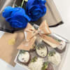An elegant combination of deep blue roses and 9 hand-decorated chocolate-covered strawberries.