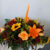 Graciously gather your family around the warm glow and classic autumn colors
