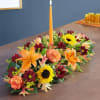 A Thanksgiving centerpiece filled with our beautiful flowers in fall-themed colors.
All-around arrangement