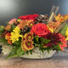Enjoy this autumn inspired centerpiece full of fresh full of flowers for