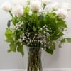 A graceful bouquet of white roses, framed by baby&#039;s-breath filler. The sophisticated