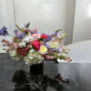 Beautiful arrangements with pink roses, lavender sweet peas, white hydrangea, with pink