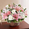 Basket arrangement of white roses, alstroemeria and monte casino and pink Asiatic