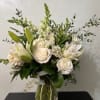 All white florals, seasonal to include such as, roses, lilies, dahlias, calla
