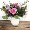A keepsake pitcher holds a wildflower mix of blooms. While supplies last.
