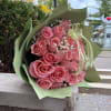 A kiss made of flowers. 
This charming bouquet of 24 pink roses