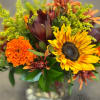 Celebrate the colors of fall with this vibrant design featuring bold sunflowers