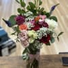 Mix of different color of roses, spray roses and fillers. 