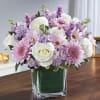 Arrangement of white roses and carnations, lavender stock, cremones, daisy poms and
