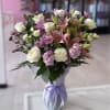 A vase arrangement with a delightful mix of blooms. Light pink lilies