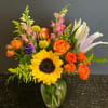 a nice Kansas inspired mix of flowers including Sunflowers, Spray Roses, lilies