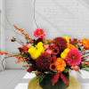 This arrangement radiates warmth and brightness &mdash; like a golden harvest catching