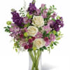 Lush purple blooms, this enchanting bouquet is a beautiful way to brighten