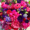Jewel tone roses , peonies and ranunculus. Bright beautiful blooms perfect for