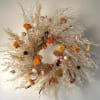 This beautiful wreath is fully dried and artfully crafted in store by
