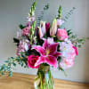 This elegant vase is filled with a beautiful arrangement of pink and