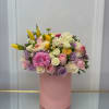 This arrangement mixes pink, white, lavender, and yellow, making a perfect gift.