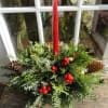 This arrangement is the perfect table display with mixed holly, evergreens and