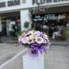 A box arrangement of flowers offers a modern and elegant presentation, where