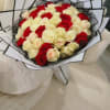 A luxurious bouquet of red and ivory roses, artfully arranged for timeless