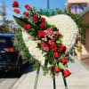 Heart sympathy arrangement (white chrysanthemums) , with cluster of red roses, pink