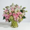 Overflowing with elegance and charm, this lush arrangement of premium roses, hydrangeas