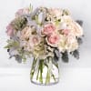 The Beautiful Whisper Bouquet is an elegant floral arrangement that exudes grace