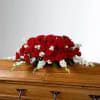 Our Eternal Love Casket Spray of red roses and white flowers in