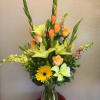 A tall &amp; beautiful arrangement containing Gladiolas, Gerberas, Lilies, Roses, etc..