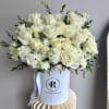  This stunning floral arrangement showcases a luxurious blend of fresh white