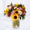 &quot;Sunset Radiance&quot; is a beautifully curated floral arrangement that exudes warmth and