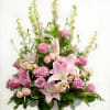 Celebrate the beautiful moments shared with your loved one. This arrangement of